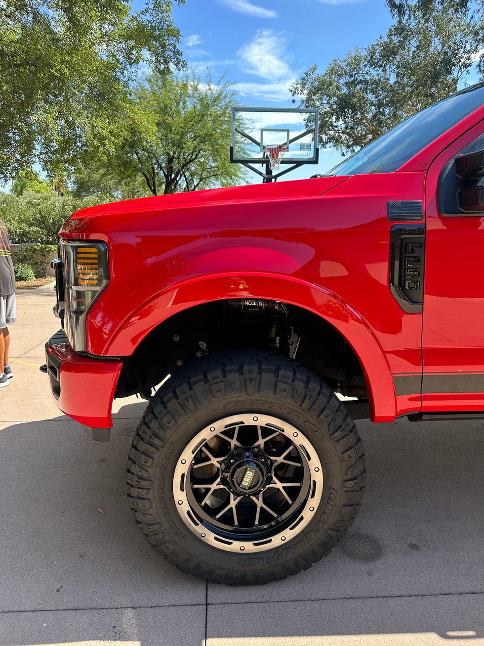 Ford F-250 Lariat wheel and tire professionally cleaned during a paint correction service