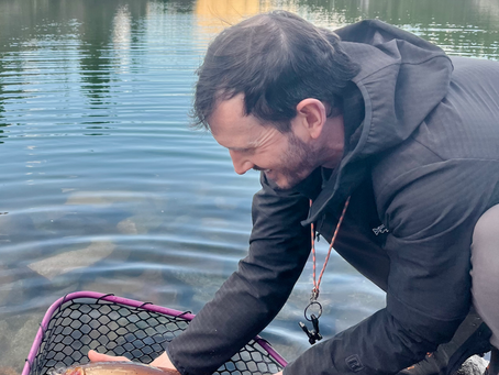 Shop Manager Michael holding a beautiful Cutthroat trout