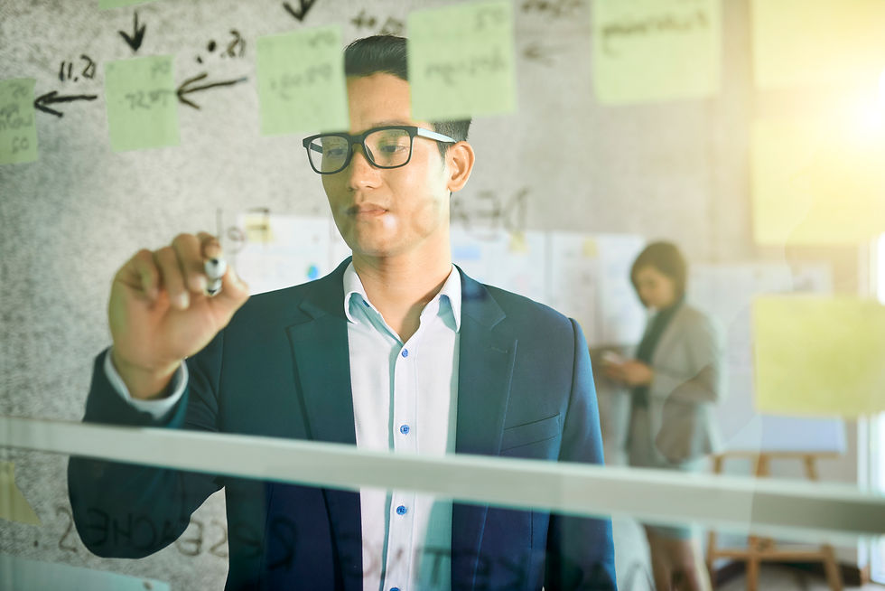 man write on the glass board the idea of innovation