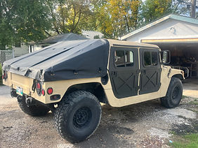 Desert tan HMMWV with black sailcloth vinyl slant back