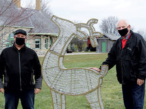Councillors Garon and Bowman add holiday lights to Heritage Gardens Park