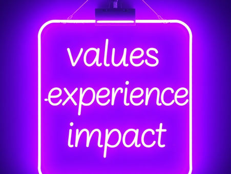 A neon sign saying values, experience, impact.