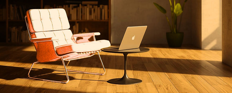 Retro armchair in front of bookcase with a laptop open on a coffee table.