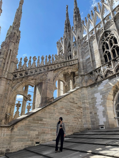Acela Kandola standing on the roof of the Milan Cathedral