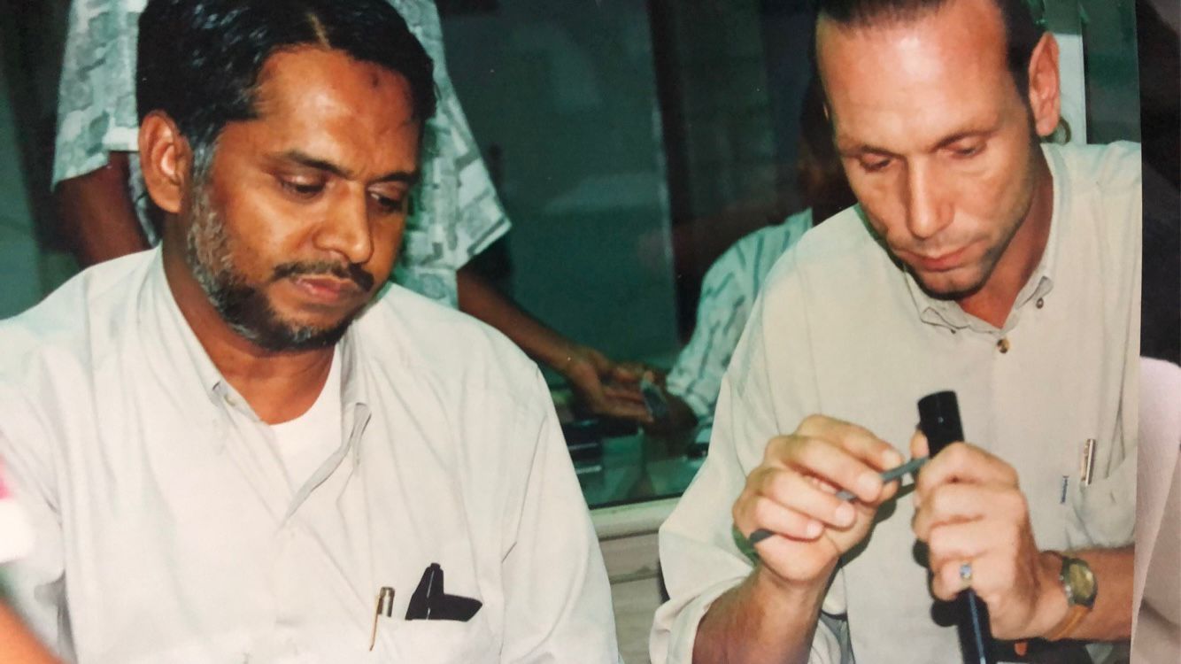 Niels Orloff inspecting a rough stone during an expedition in the famous gemstone city of Ratnapura, Sri Lanka. Summer - 1998.