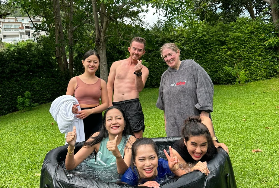 Close-up of hands submerged in ice water at a Koh Samui ice bath session.