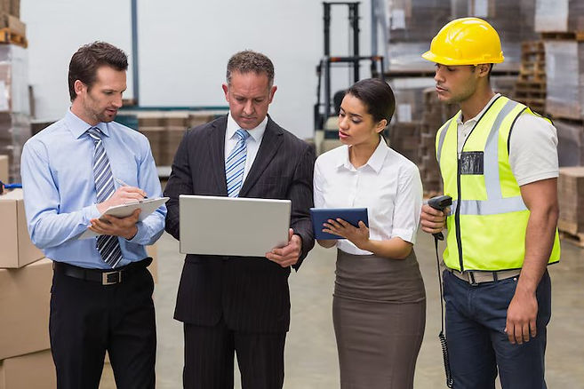 focused-warehouse-team-working-together_13339-80382.jpg