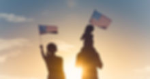 Patriotic silhouette of family waving American USA flags. .jpg