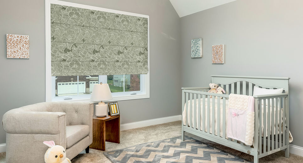 Beautiful Soft Roman Shades are used in this Modern Nursery in Northern NJ to provide privacy and room darkening for nap time