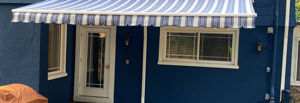 Motorized awning professionally installed over an existing downspout in Hillside, NJ