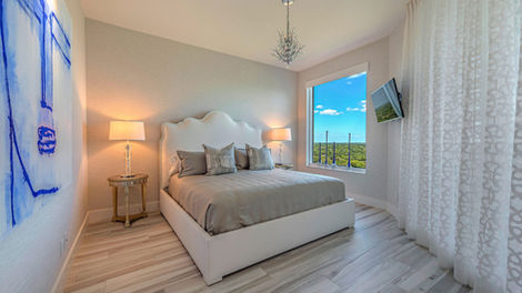 Modern Pelican Bay V bedroom with scallopped headboard