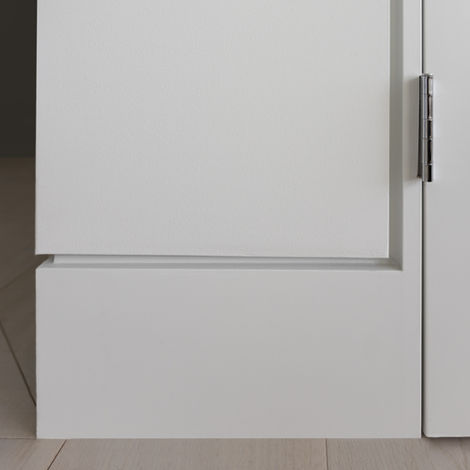 Close-up of white modern interior door and baseboard.
