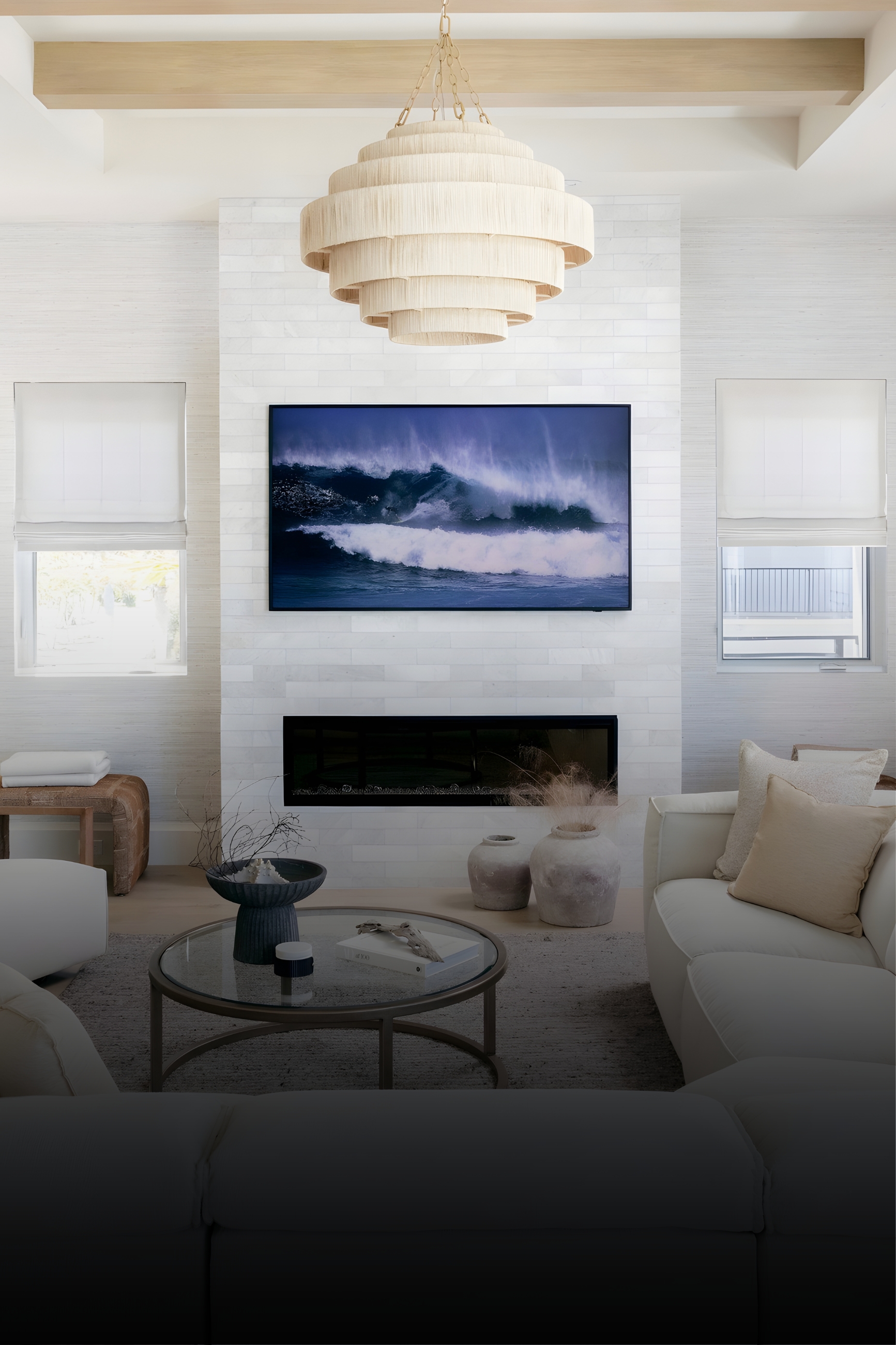 Modern living room with fireplace, TV, and pendant light