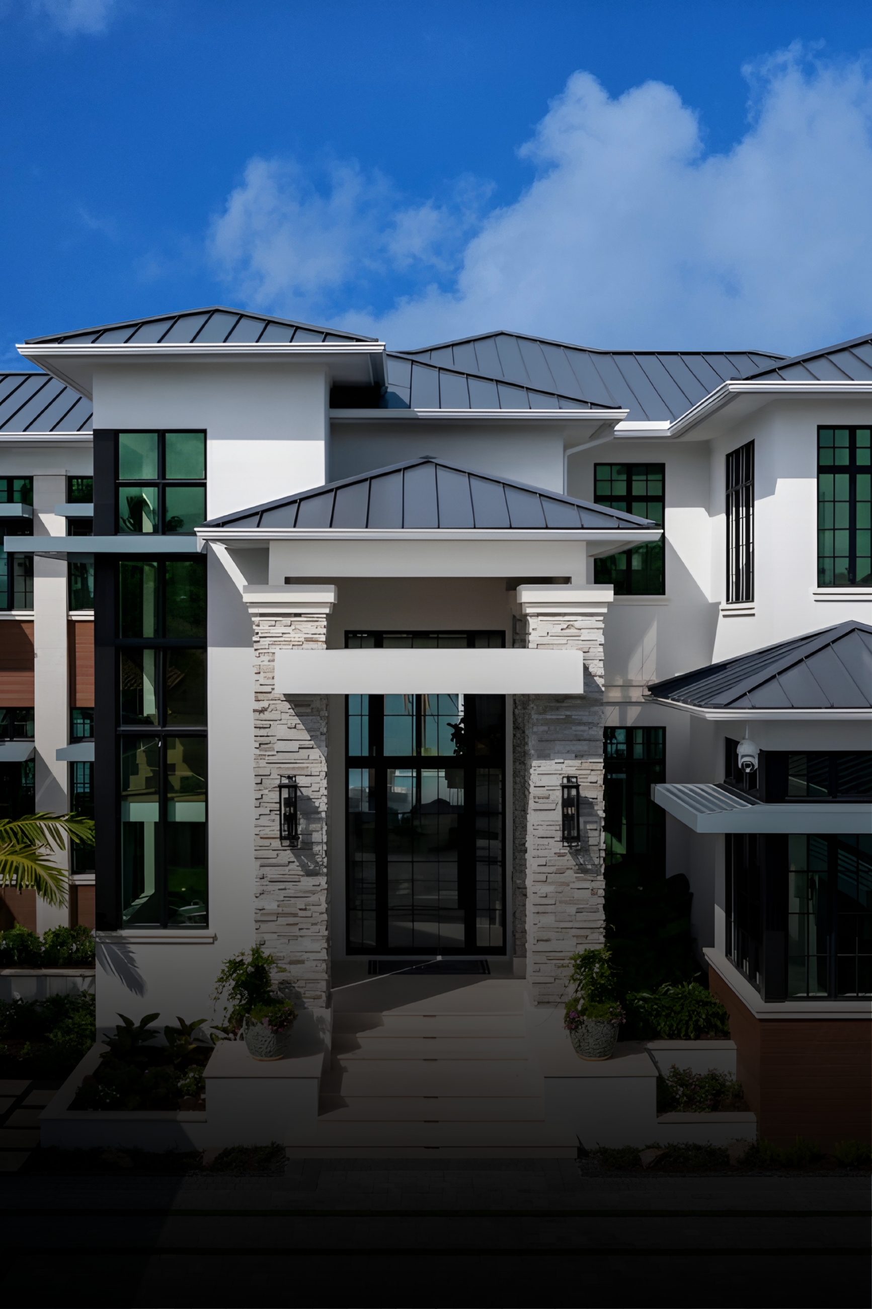 Modern white house exterior under a blue sky