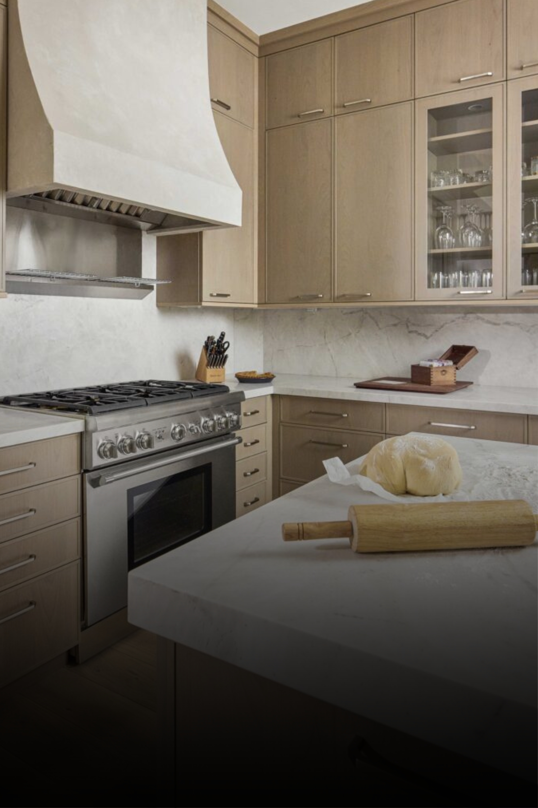 Modern kitchen with wood cabinets and stainless range