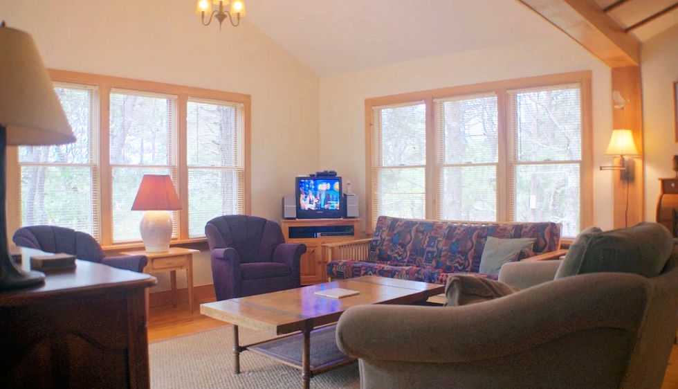 living room lounge space with tv and coffee table