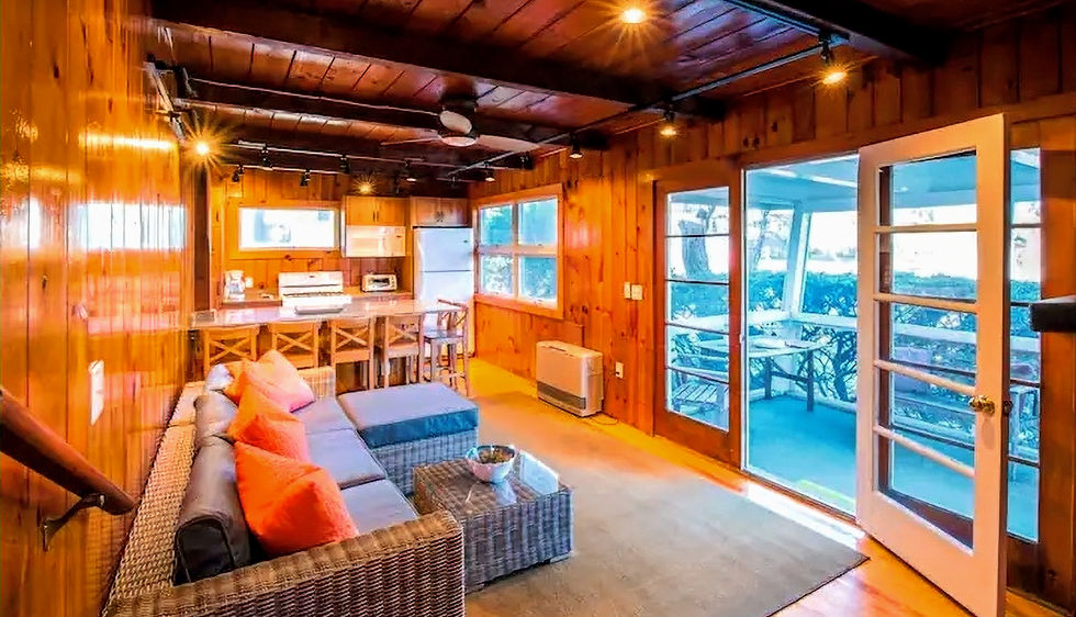 Sea View oceanside cottage living room with couch and open seating