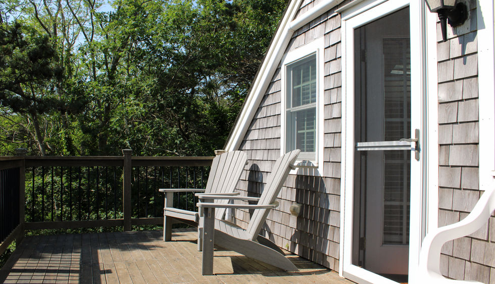 upstairs deck with lounge chairs