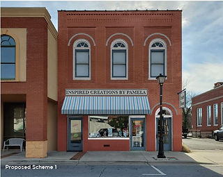 Brick building, "INSPIRED CREATIONS BY PAMELLA" storefront with striped awning.