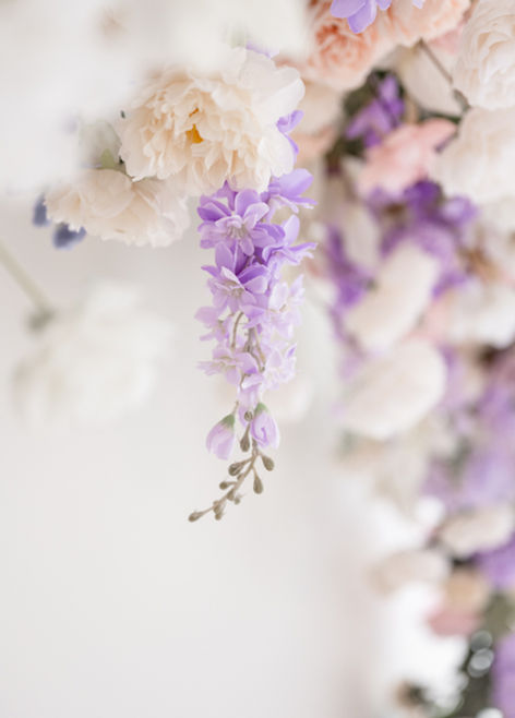 Hanging spring flowers detail on studio wall