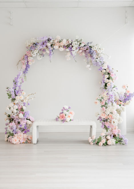 Spring floral arch backdrop in Aurora photo studio