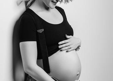 Pregnant lady against the wall