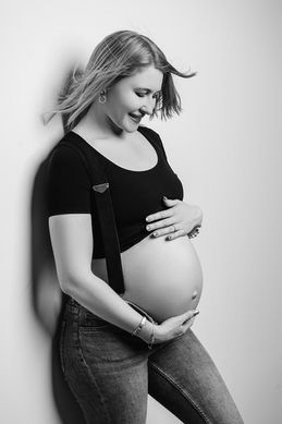 Pregnant lady against the wall