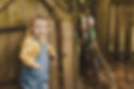 Children playing outside in woods