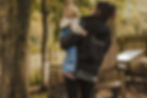 Nursery staff helping child