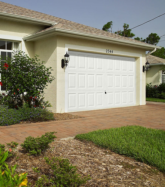 White up-and-over garage door with panelled effect