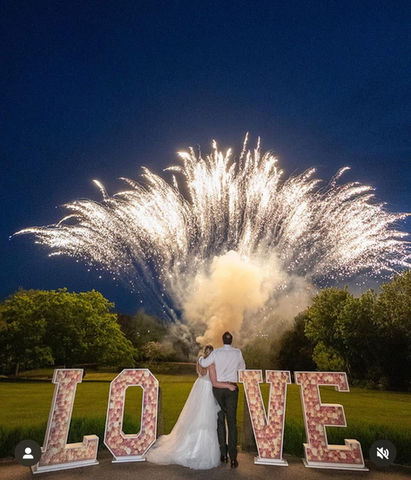 Bride and groom watching fireworks