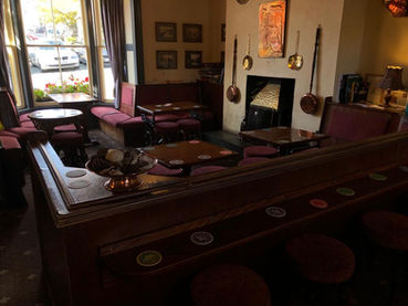 Bar seating around fireplace