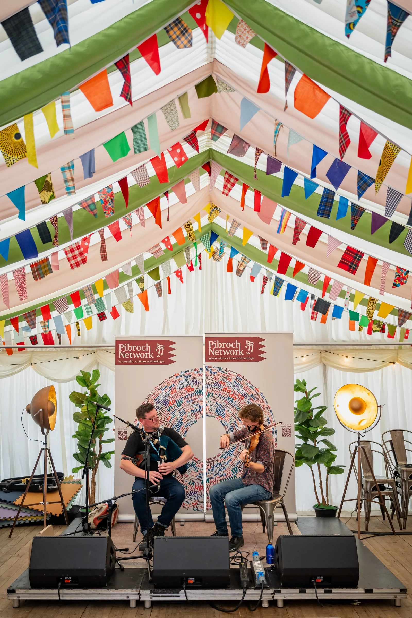 Donald and Roo playing beneath the bunting in the Piping Live tent