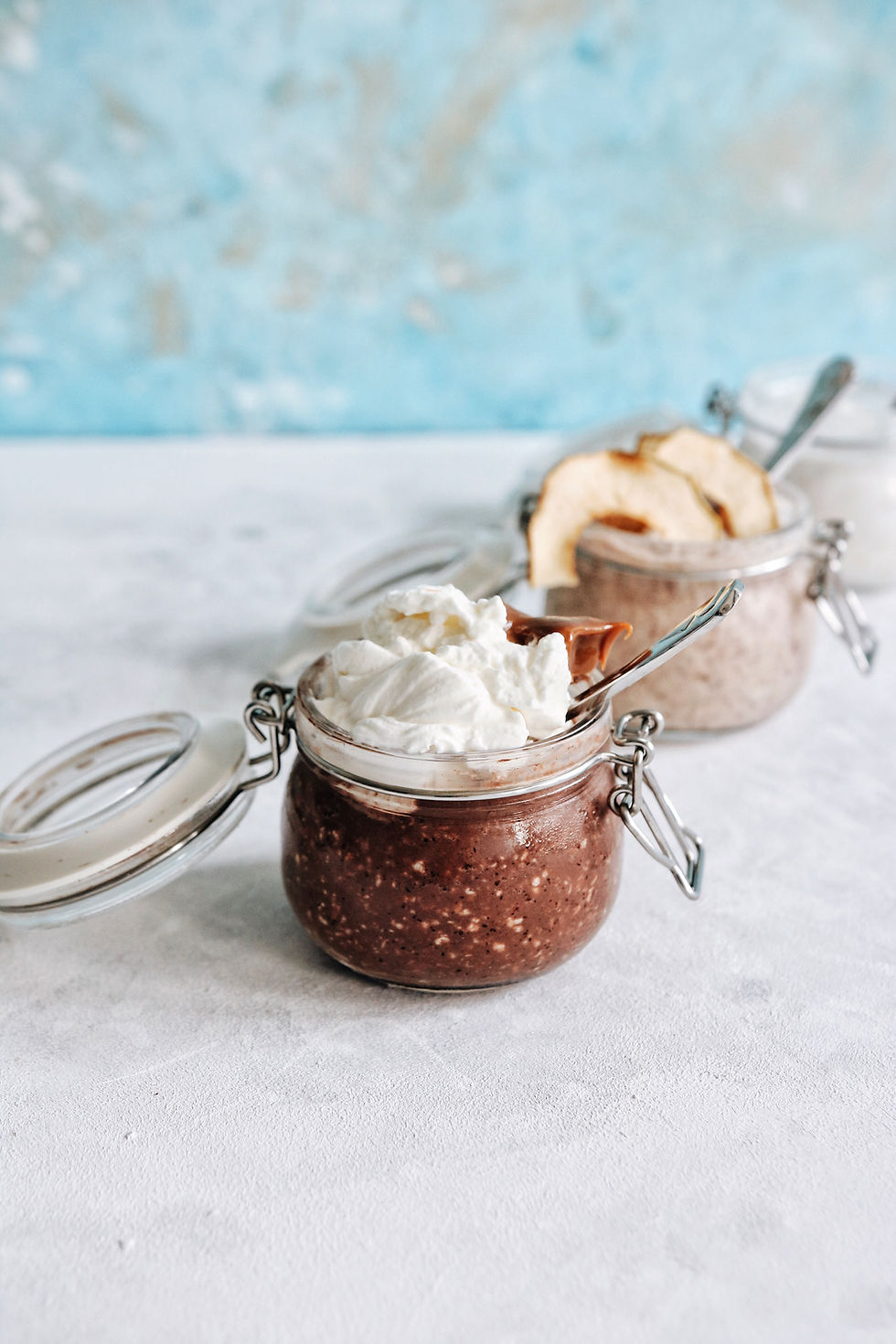 A trio of gluten free overnight oats: chocolate and caramel, apple pie, and coconut.