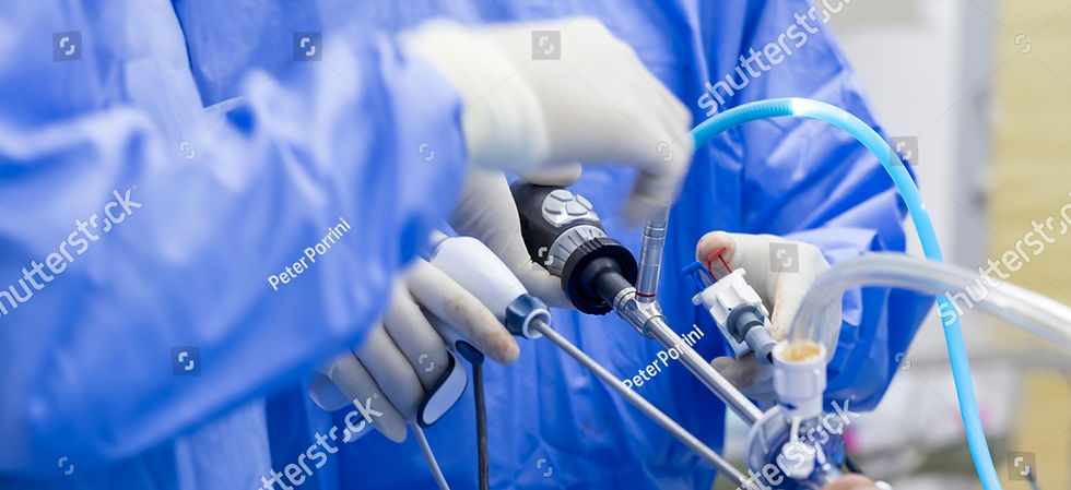 stock-photo-doctor-in-blue-sterile-surgical-gown-doing-surgery-with-camera-and-instrument-