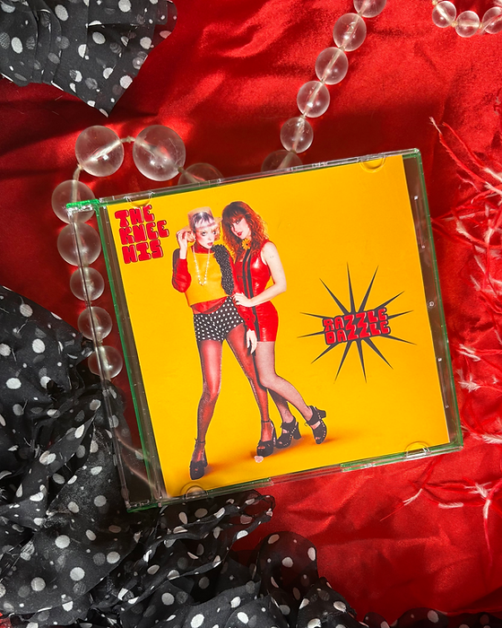 Razzle Dazzle CD | Thekneehis
