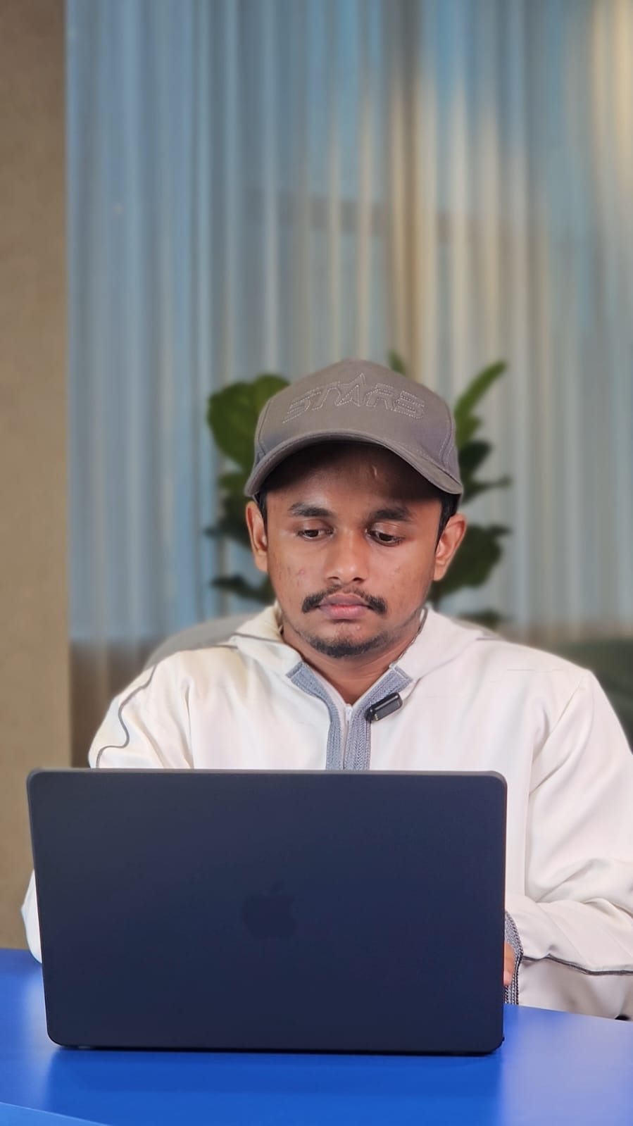 Course trainer working on a laptop