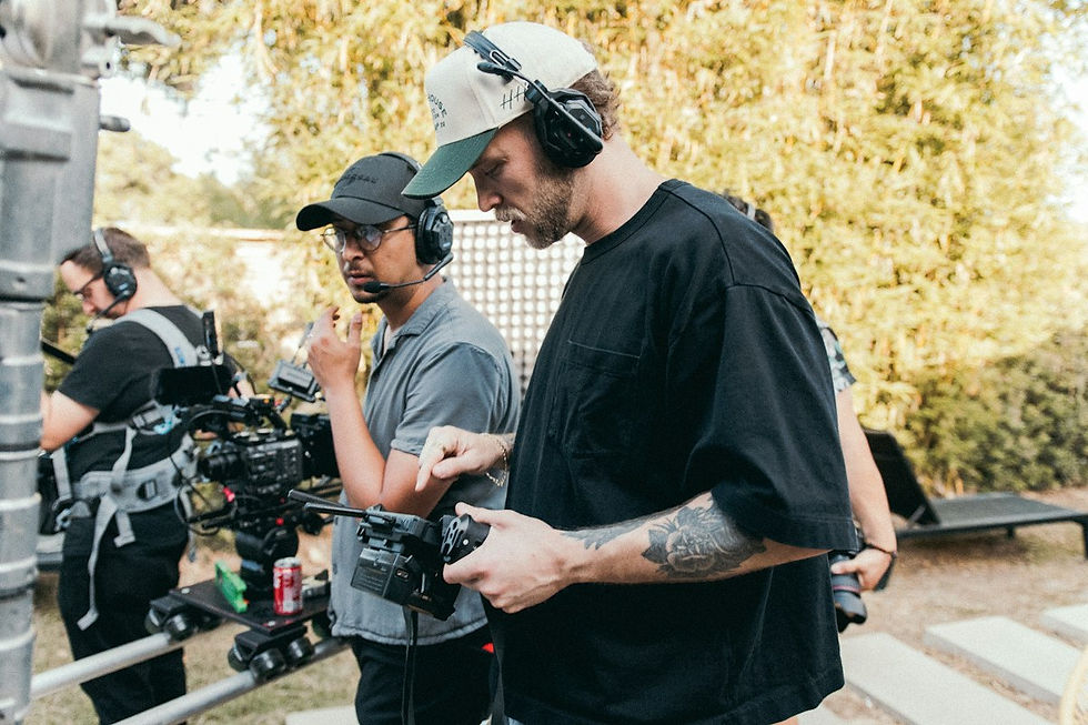Film crew planning an outdoor camera shot before visual effects production