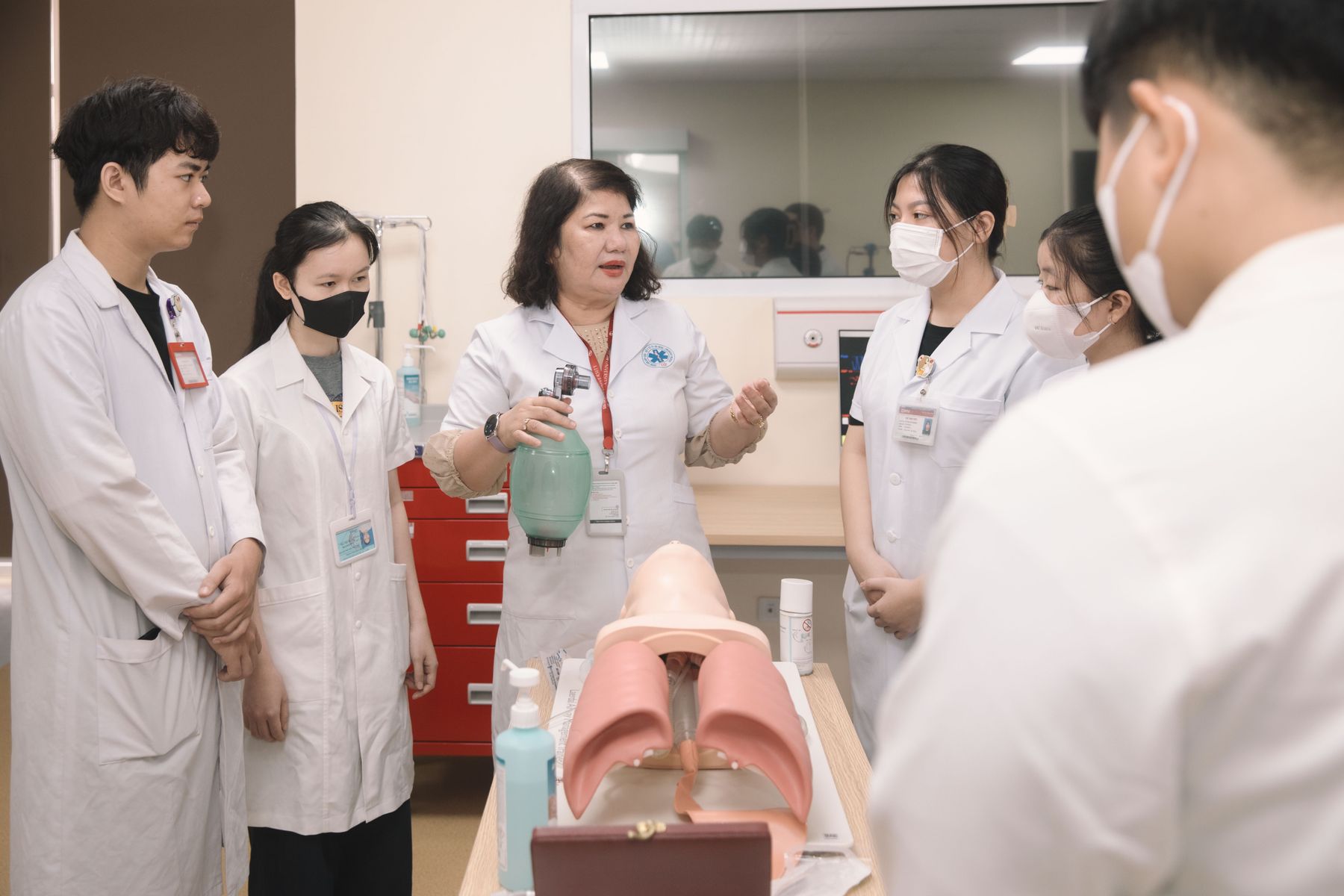 Medical students practicing clinical skills in a healthcare simulation environment