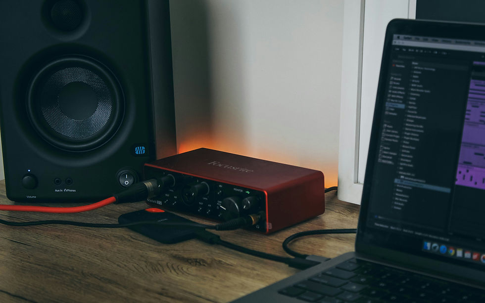 Music studio laptop and speakers used to organize a music video distribution release package