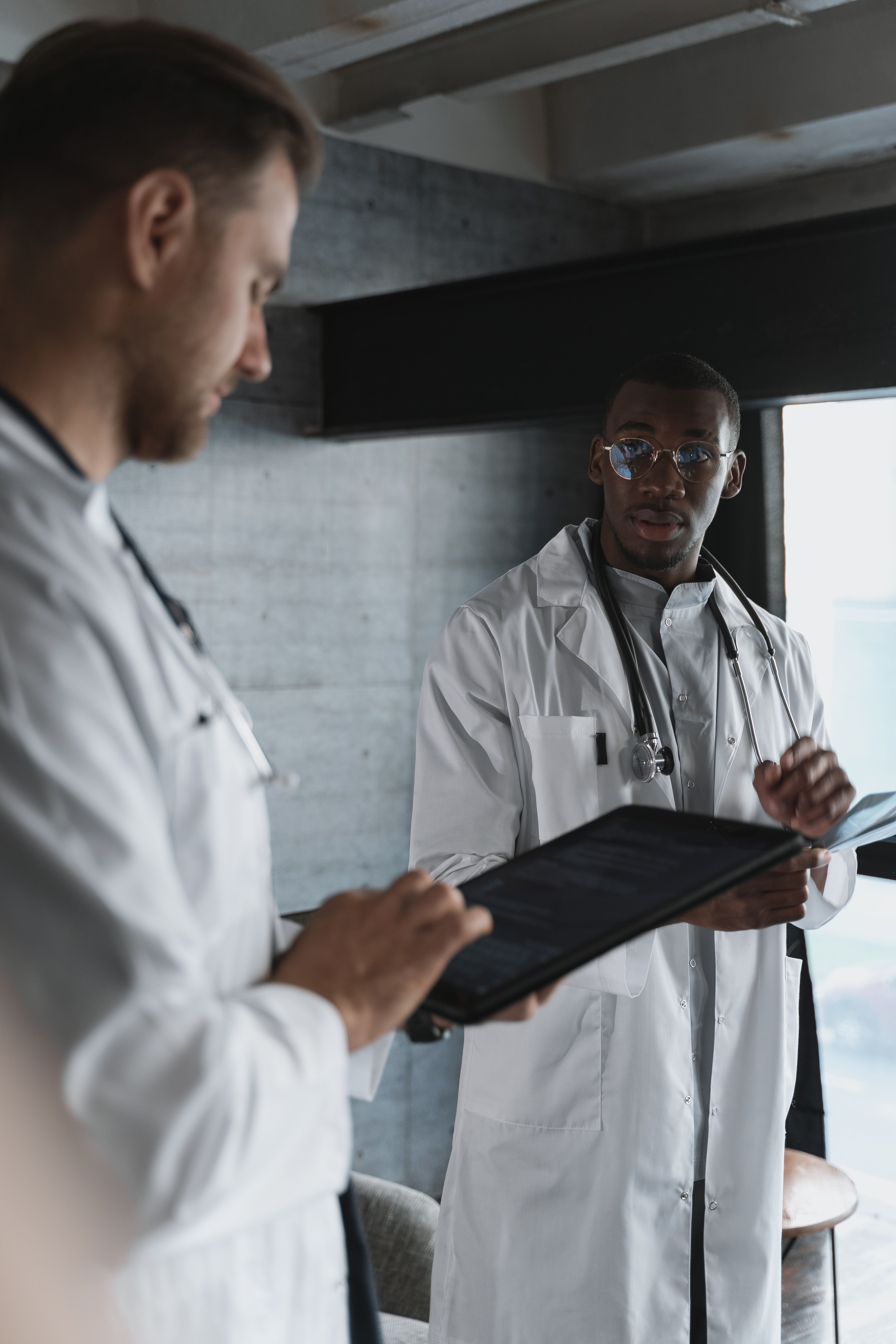 Doctors reviewing digital information together during clinical training