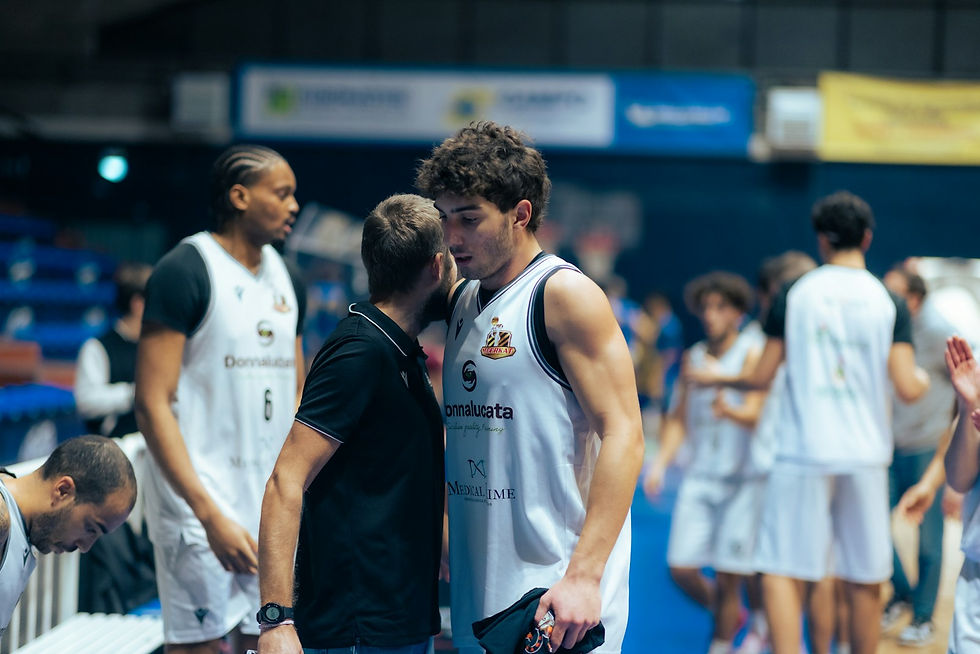 Coach reviewing performance with an athlete after computer vision analysis