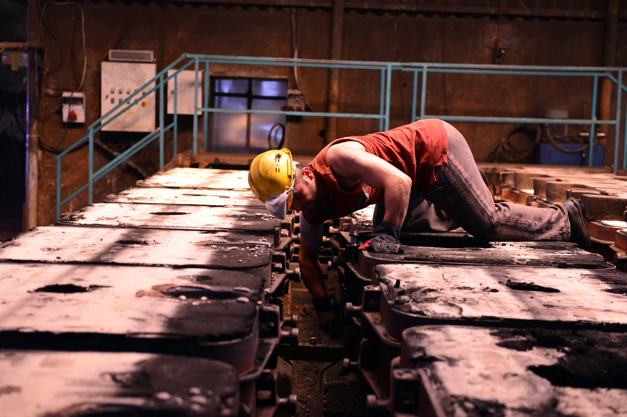 Industrial technician inspecting equipment during an AR maintenance pilot