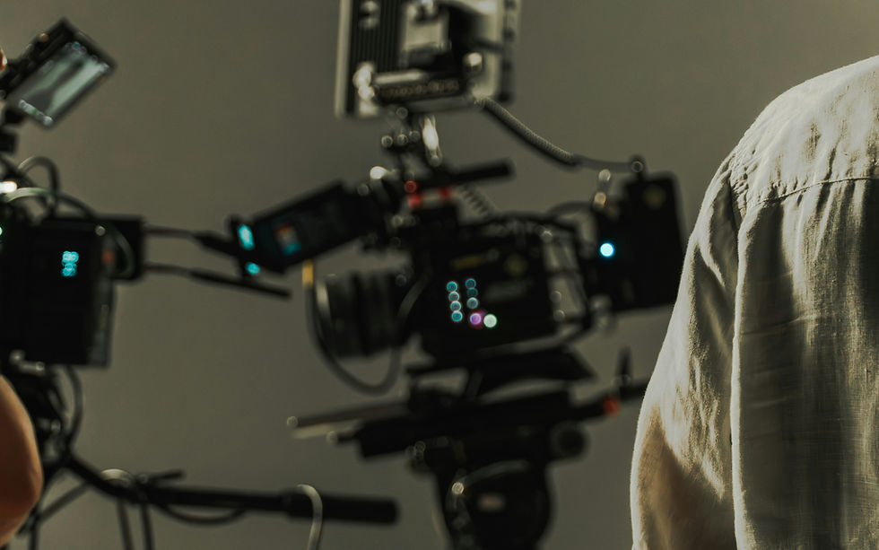 Professional cinema cameras and crew on a studio set showing the main cost drivers in music video production