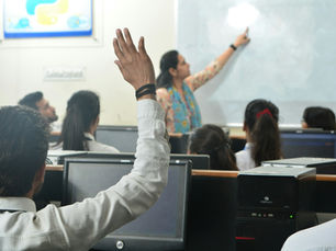 Students and teacher in a computer classroom using an AI tutor safely