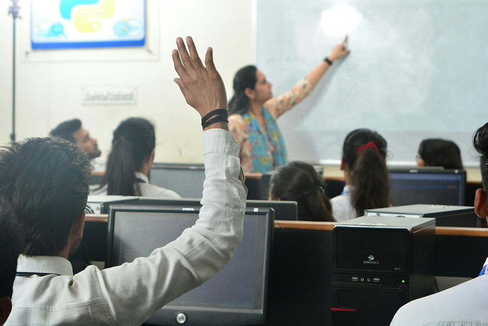 Students and teacher in a computer classroom using an AI tutor safely