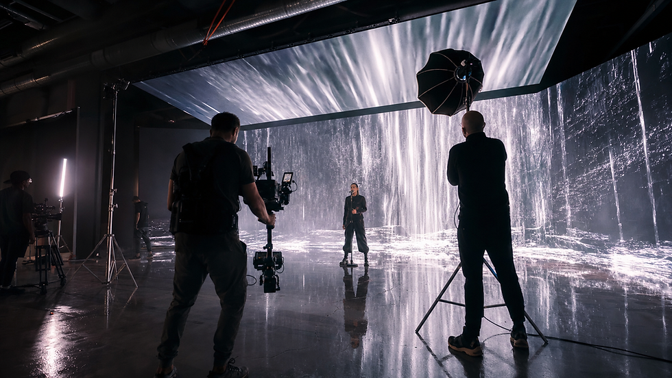 Singer performing on an LED virtual production stage for a CGI music video