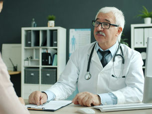 Doctor and patient discussing a care decision during a consultation
