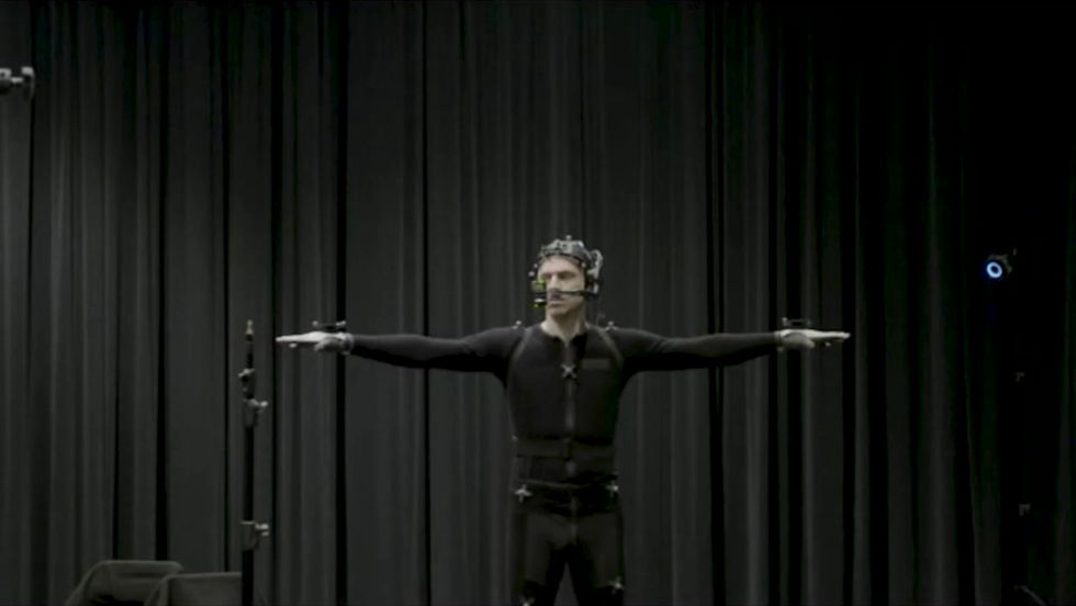 A performer using motion tracking to create a live immersive visual performance
