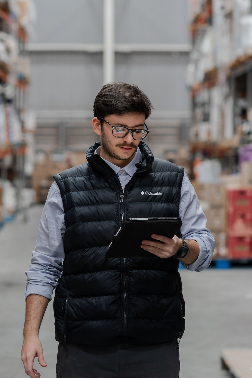 Warehouse professional using a tablet for augmented reality training planning